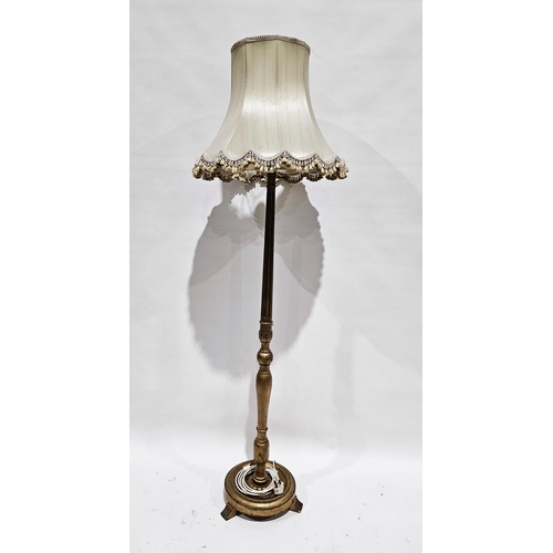 1097 - Giltwood standard lamp, the turned part fluted and part baluster column on a circular plinth base wi... 