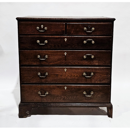 1143 - George III oak chest of two short over four long graduated drawers, each drawers with bone escutcheo... 