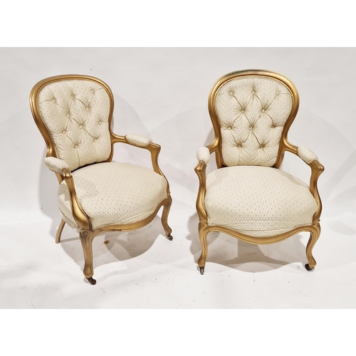 1162 - Pair of 20th century giltwood button back armchairs, raised on front cabriole legs, 90cm high