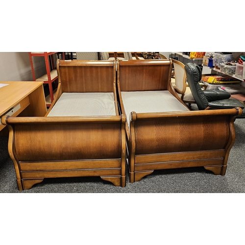 1165 - Two stained wooden veneered framed single sleigh beds (2)