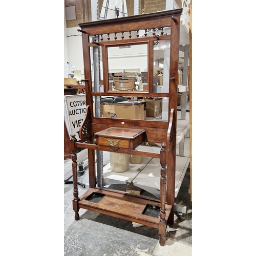 1168 - Late 19th / early 20th century mahogany hallstand, the mirrored back with six turned wooden coat hoo... 