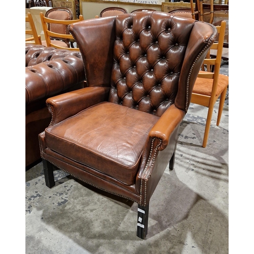 1195 - Office reception chesterfield style brown leather wingback armchair, in the 18th century manner with... 