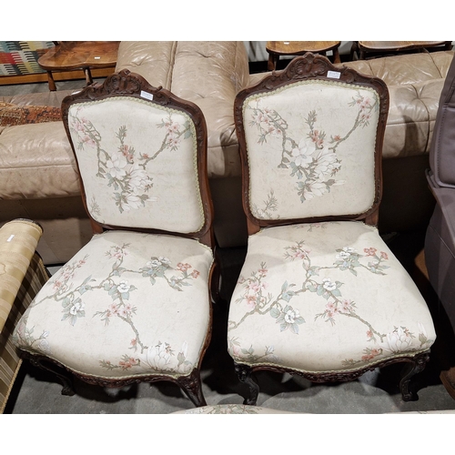 1198 - French rosewood salon suite comprising a settee and pair of side chairs, each with foliate carved fr... 