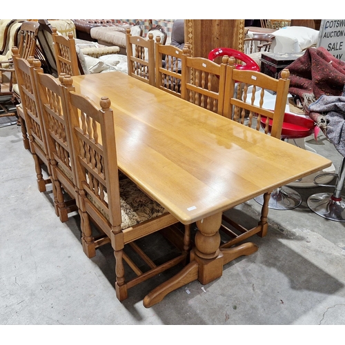 1214 - Pale oak dining room suite comprising a refectory table in the 17th century manner, the plank top on... 