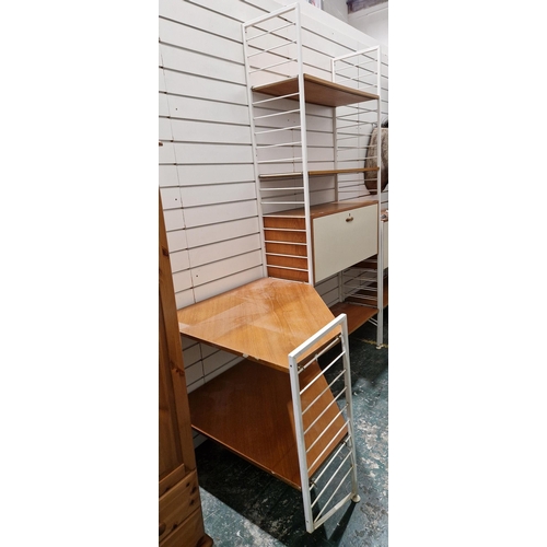 1218 - Mid-century Ladderax stacking unit comprising a four tier section with three shelves and a lockable ... 