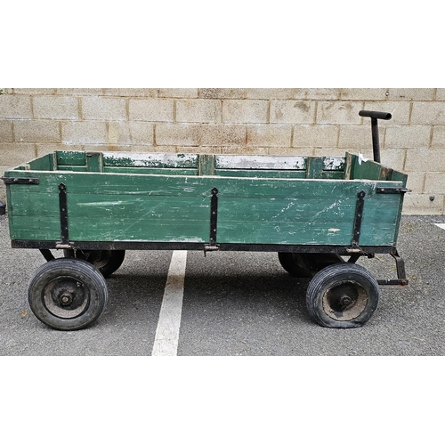 1219A - Green painted wooden pull-along cart, with hinged drop down sides, cast iron frame with pull handle,... 