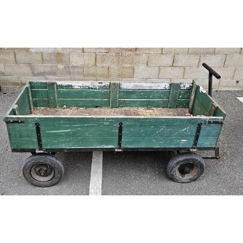 1219A - Green painted wooden pull-along cart, with hinged drop down sides, cast iron frame with pull handle,... 