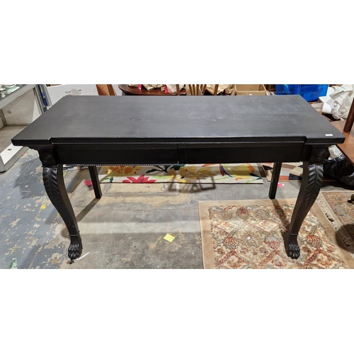 1227 - Mahogany serving table in the George III Irish manner, later painted black, the frieze with two draw... 