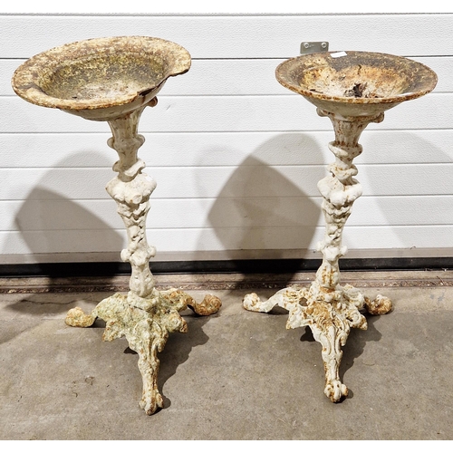 1242 - Two similar cast iron pedestal bird baths, largest 75cm high x 34cm diameter