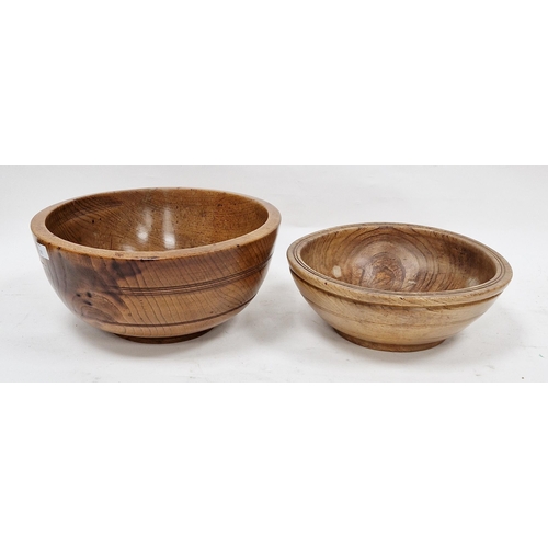 160 - Two treen elm bowls in sizes, each turned, the first 19th/early 20th century (with repair to foot), ... 