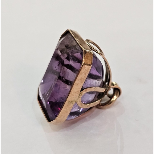 191 - 9ct gold and amethyst fob pendant with rectangular faceted stone in pierced hanging mount