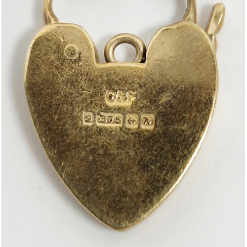 195 - Two 9ct yellow gold heart-shaped padlock clasps, largest 3cm, total weight 8.9 grams together with s... 