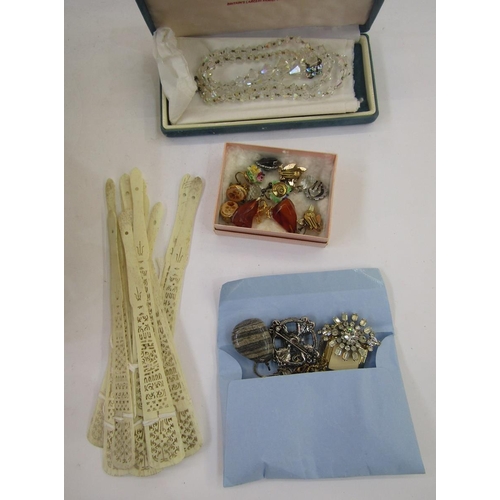 216 - Quantity of assorted costume jewellery, including brooches, necklaces, two cap badges for the Glouce... 