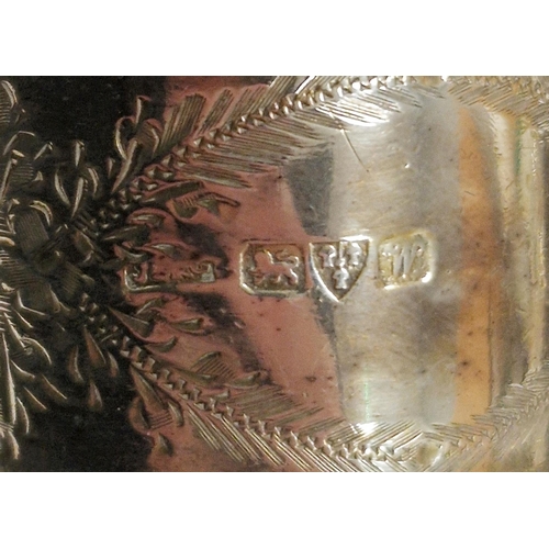 230 - Pair of George V silver cased napkin rings, Chester 1922, J & R Griffin, of oval form with cast scro... 