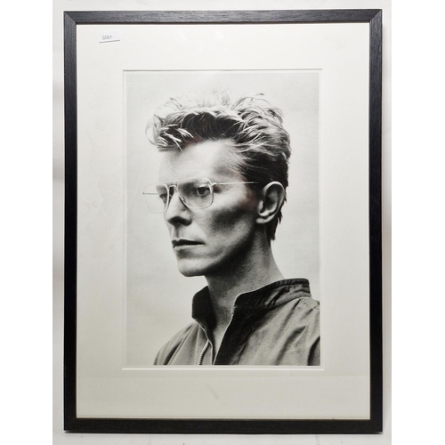 251 - After Helmut Newton (1920-2004)
 Photographic print
 Framed portrait of David Bowie, a crop of the o... 