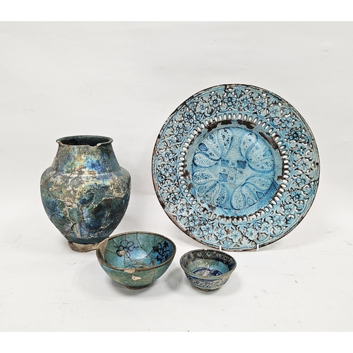 26 - Group of Persian turquoise glazed pottery to include an Iranian 18th-19th century pierced charger, t... 