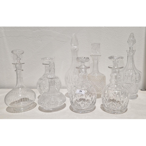 54 - Group of eight cut-glass and etched decanters and stoppers, including: a Victorian globular decanter... 