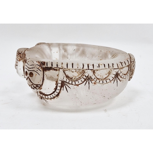 61 - Tibetan carved rock crystal skull cap bowl 'Capala', carved with stylised masks and swags enriched i... 