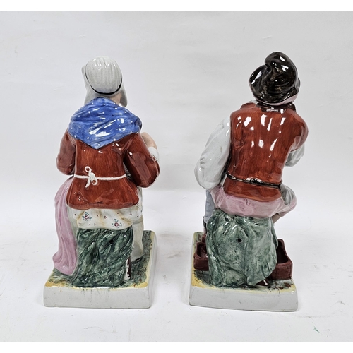 8 - Pair of Staffordshire pottery figures of a cobbler and companion, late 19th/early 20th century, each... 