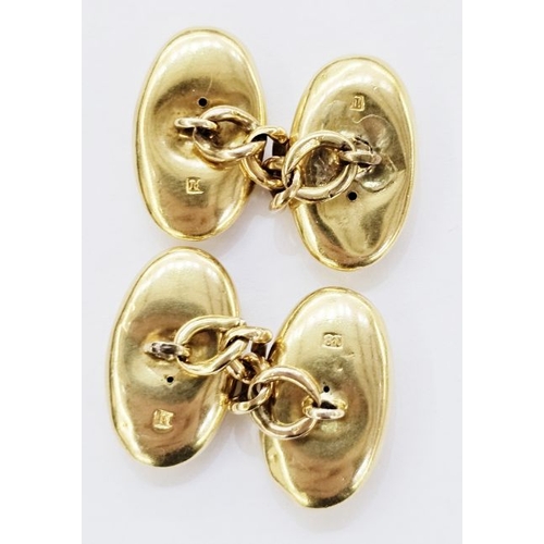 168 - Pair of gold cufflinks with polished oval form with chain links marked 18 to the heads and 15ct to t... 