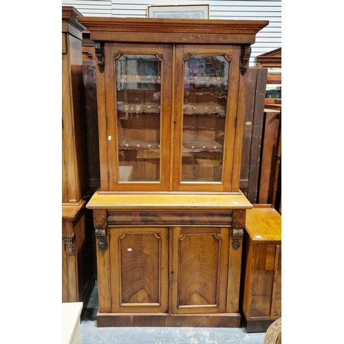 1045 - Victorian glazed library bookcase, the moulded cornice over two glazed doors with moulded edge openi... 