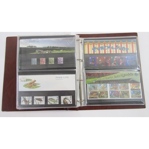 303 - GB stamps: With face value c£500, 2 albums of QEII decimal presentation packs and one of bespoke fir... 