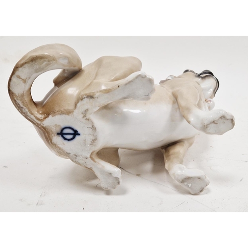 1 - Continental porcelain model of a seated pug in the Meissen style, 20th century, blue crossed circle ... 