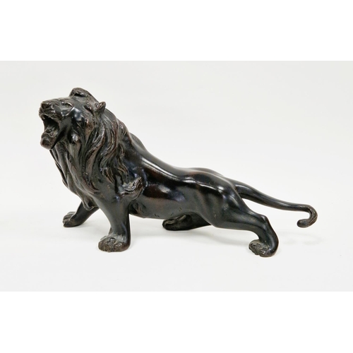 160 - Bronze sculpture of a roaring lion, 34cm long