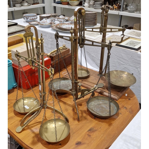 172 - Set of late 19th / early 20th century brass balance scales by W & T Avery Ltd on three splayed feet,... 