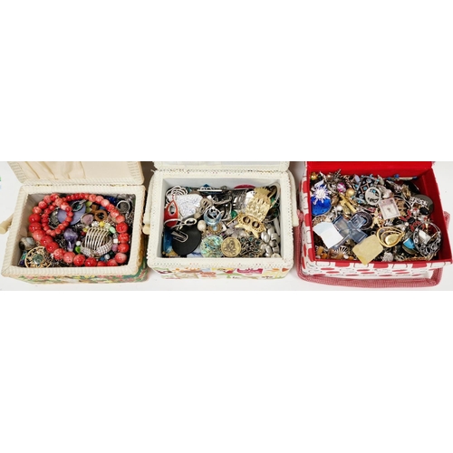 273 - Three fabric covered sewing or jewellery boxes full with mixed costume jewellery including rings, br... 