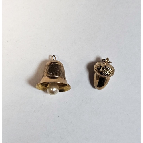 287 - Two 9ct gold charms, one in the form of a bell (1.2cm high), the other an acorn, 3.1g approx.