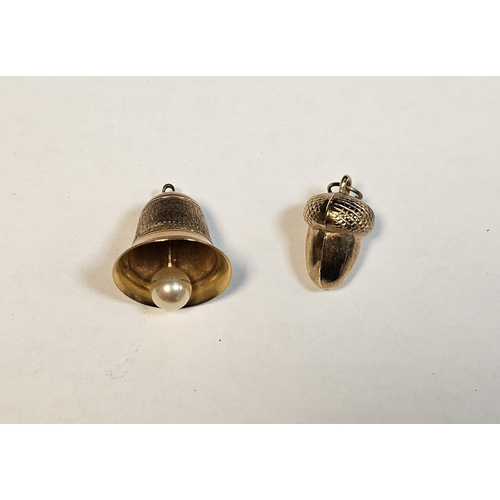 287 - Two 9ct gold charms, one in the form of a bell (1.2cm high), the other an acorn, 3.1g approx.