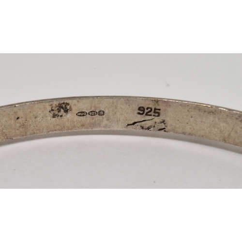 275 - Three silver torque bangles, silver hinged bracelet with engraved decoration and three further silve... 