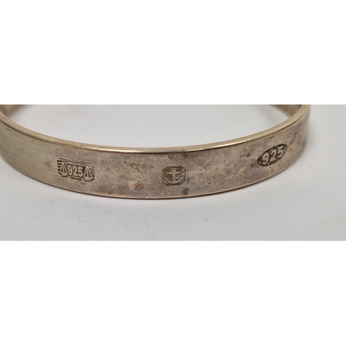 275 - Three silver torque bangles, silver hinged bracelet with engraved decoration and three further silve... 