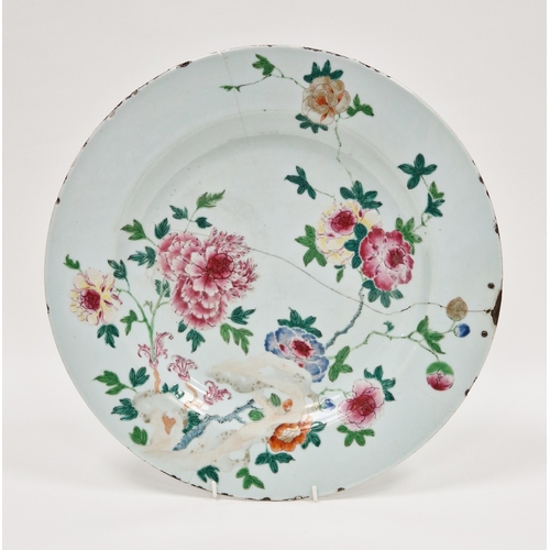 121 - Chinese export famille rose charger, 18th century, painted with a peony and other flowers amongst le... 