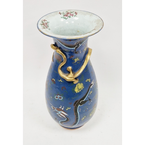 128 - Late 19th century Chinese porcelain baluster blue ground vase, moulded with a scrolling dragon enric... 
