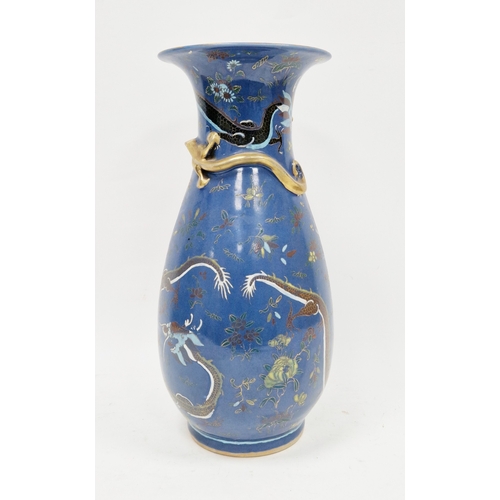 128 - Late 19th century Chinese porcelain baluster blue ground vase, moulded with a scrolling dragon enric... 