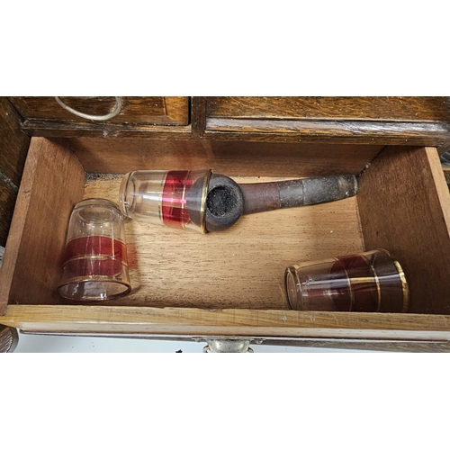 159 - Early 20th century oak smoker's cabinet, the two panel doors opening to an interior fitted with draw... 