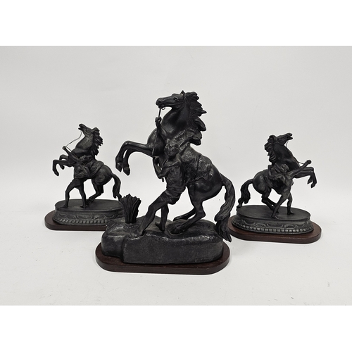 163 - Pair of spelter Marley horses on mahogany oval plinths, 23cm high and a single spelter Marley horse ... 