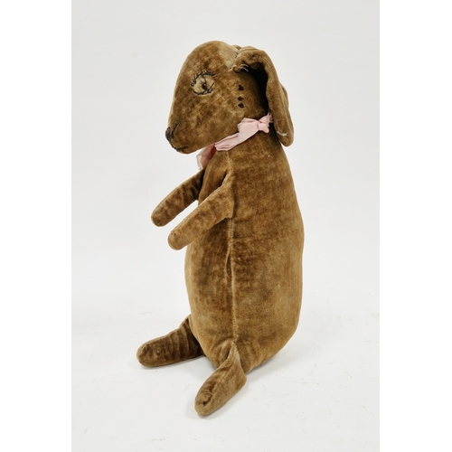 169 - Early to mid-20th century velvet toy rabbit, with stitched eyes, nose and mouth, wearing a pink ribb... 