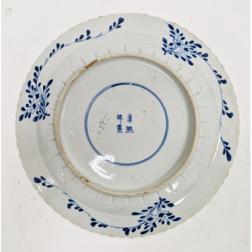 123 - Three Chinese porcelain blue and white 'fishes' plates in the Kangxi style, probably later, with fou... 