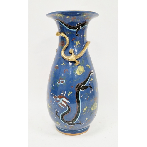 128 - Late 19th century Chinese porcelain baluster blue ground vase, moulded with a scrolling dragon enric... 