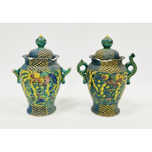 130 - Pair of Japanese late Meiji period (1868-1912) green ground pottery vases and covers, each with red ... 