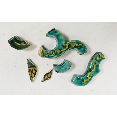 130 - Pair of Japanese late Meiji period (1868-1912) green ground pottery vases and covers, each with red ... 