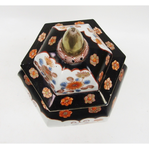 131 - Imari inverted baluster faceted section vase and domed cover, painted in iron red, blue and gilding ... 