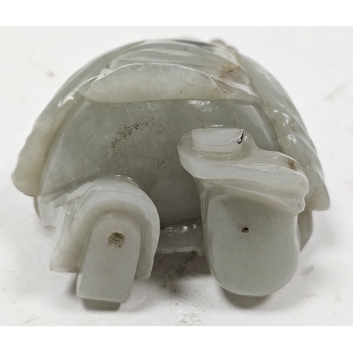 137 - Chinese carved pale celadon jade model of a kneeling boy on wooden stand, Qing Dynasty, with his lef... 