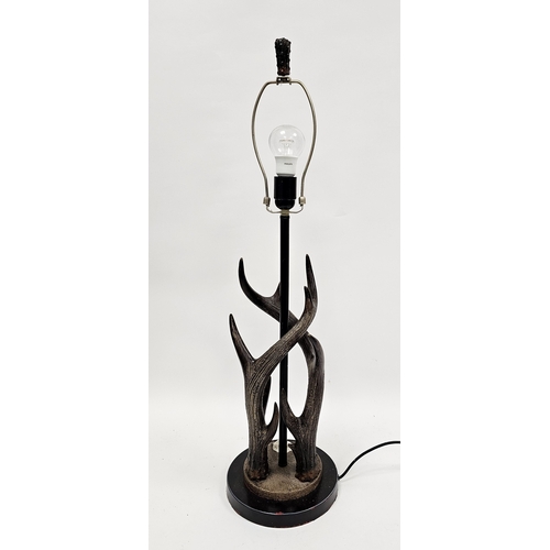 144 - Modern table lamp in the form of two entwined stag horns on a circular base with black finish, 60cm ... 