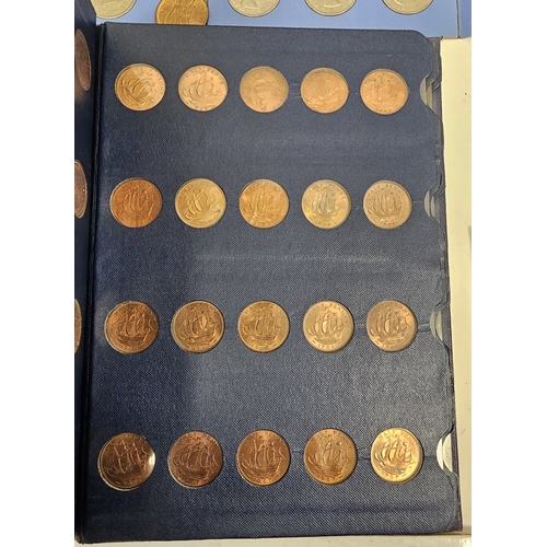 146 - Collection of coins and stamps including three Sandhill coin library albums, one containing half pen... 