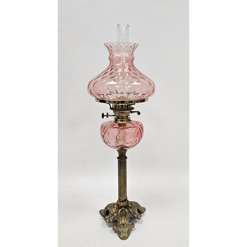 168 - Victorian oil lamp having pink tinted moulded glass shade and well, clear glass chimney and brass Co... 