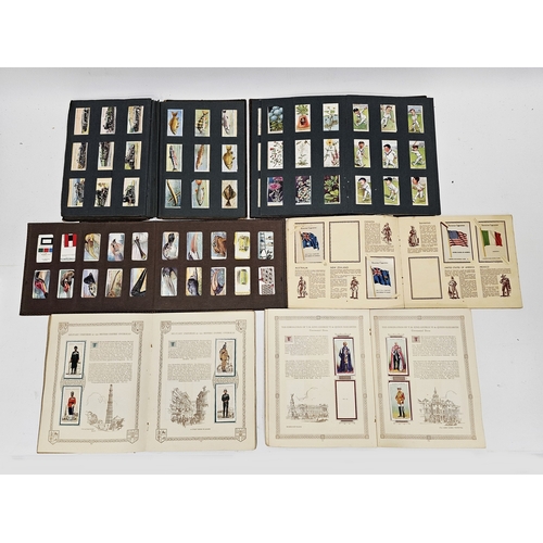 180 - Collection of cigarette and tea cards including three early 20th century cigarette picture albums, c... 